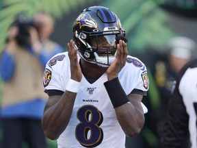 Baltimore Ravens quarterback Lamar Jackson celebrates after scoring a touchdown against the Cincinnati Bengals. (USA TODAY SPORTS)