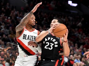 Toronto Raptors guard Fred VanVleet  drives to the basket against Portland Trail Blazers guard Damian Lillard during Wednesday's game. (USA TODAY SPORTS)