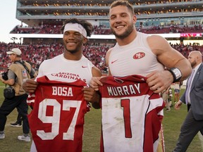 Kyler Murray of the Arizona Cardinals and Nick Bosa of the San Francisco 49ers exchange jerseys after their game on Sunday. (GETTY IMAGES)