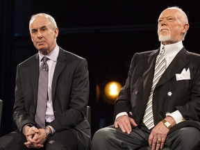 Ron MacLean (left) sits beside Don Cherry as Rogers TV unveils their team for the station's NHL coverage in Toronto on Monday, March 10, 2014.  THE CANADIAN PRESS/Chris Young