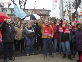 Sam Hammond, president of the Elementary Teachers' Federation of Ontario joins protesting teachers union members as they gather outside Ogden Junior Public School where Ontario Education Minister Stephen Lecce was making an announcement, in Toronto, Wednesday, Nov. 27, 2019. THE CANADIAN PRESS/Chris Young