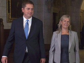 Leader of the Opposition Andrew Scheer walks with Leona Alleslev, who crossed the floor from the Liberal party to Conservative party, on Parliament Hill in Ottawa, Monday, September 17, 2018.  THE CANADIAN PRESS/Adrian Wyld