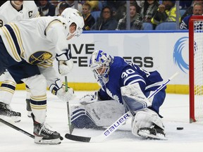 Buffalo Sabres forward Jimmy Vesey (13) puts the puck past Toronto Maple Leafs goalie Michael Hutchinson (30) during the third period of an NHL hockey game Friday, Nov. 29, 2019, in Buffalo, N.Y. (AP Photo/Jeffrey T. Barnes)