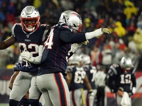 New England Patriots' Dont'a Hightower (right) and Devin McCourty celebrate during their win over Dallas on Sunday. (USA TODAY SPORTS)