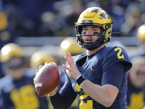 Shea Patterson of the Michigan Wolverines drops back to pass during their game against the Michigan State Spartans earlier this month. (GETTY IMAGES)