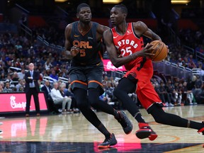 Toronto Raptors forward Chris Boucher drives to the basket against Orlando Magic center Mo Bamba on Friday night. (USA TODAY SPORTS)