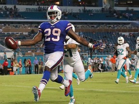 Karlos Williams #29 of the Buffalo Bills scores a touchdown during a game against the Miami Dolphins at Sun Life Stadium on September 27, 2015 in Miami Gardens, Florida.  (Photo by Mike Ehrmann/Getty Images)