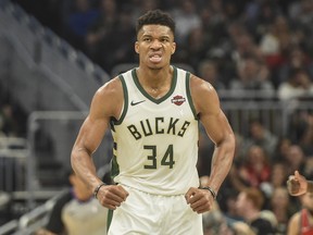 Milwaukee Bucks forward Giannis Antetokounmpo (34) reacts after scoring a basket in the second quarter during the game against the Toronto Raptors at Fiserv Forum. Benny Sieu-USA TODAY Sports