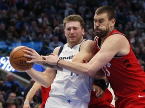 Dallas Mavericks guard Luka Doncic (77) drives against Toronto Raptors center Marc Gasol (33) during the second quarter at American Airlines Center. Tim Heitman-USA TODAY Sports