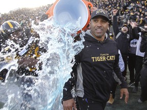 Tiger-Cats head coach Orlondo Steinauer gets doused with ice water water after defeating the Edmonton Eskimos at Tim Hortons Field in Hamilton yesterday. John E. Sokolowski/USA TODAY Sports