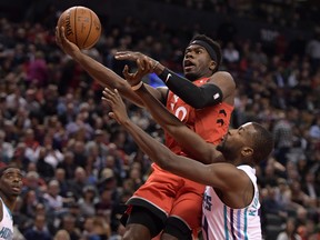 Toronto Raptors guard Terence Davis II  shoots for a lay up basket against Charlotte Hornets forward Michael Kidd-Gilchrist. Davis has been a force off the bench for the Raptors.  Credit: Dan Hamilton-USA TODAY Sports