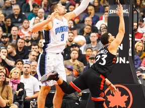 Toronto Raptors guard Fred VanVleet (23) shoots against Orlando Magic centre Nikola Vucevic (9) during their NBA game at Scotiabank Arena. Kevin Sousa-USA TODAY Sports