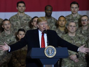 US President Donald Trump speaks to the troops during a surprise Thanksgiving day visit at Bagram Air Field, on November 28, 2019 in Afghanistan.