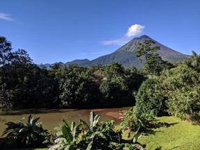 The still active Arenal Volcano looms over the grounds of the Arenal Manoa and Hot Springs Resort in Costa Rica’s northern lowlands. (Ling Hui/Postmedia Network)