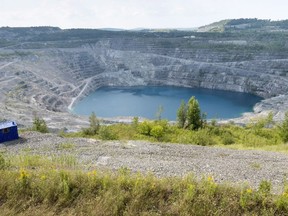 The open pit of the now closed Jeffrey mine is seen in Asbestos, Que., Wednesday, Aug. 10, 2016.