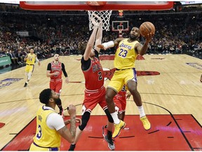 Los Angeles Lakers forward LeBron James shoots a layup in the first half against Chicago Bulls forward Luke Kornet at United Center.