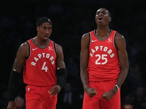 Raptors’ Rondae Hollis-Jefferson (left) and Chris Boucher celebrate during Toronto’s win over the Lakers in Los Angeles on Sunday. Both players have been solid for the Raps, who are currently without several key players due to injuries. (GETTY IMAGES)