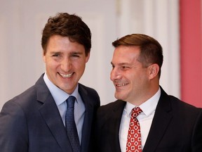 Marco Mendicino poses with Canada's Prime Minister Justin Trudeau after being sworn-in as Minister of Immigration, Refugees and Citizenship during the presentation of Trudeau's new cabinet, at Rideau Hall in Ottawa, Ontario, Canada November 20, 2019.