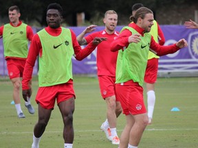 Alphonso Davies, left, and Samuel Piette of Canada take part in a training session at Sylvan Lake Park in Sanford, Fla., on Wednesday, Nov. 13, 2019. Canada play against the United States in a Nations League Group A match on Friday, Nov. 15 in Orlando, Fla.