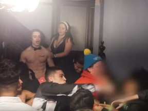 An image from video showing a knife attack at a Madison Ave. frat house.