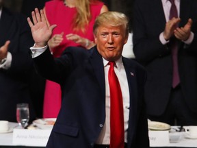 U.S. President Donald Trump exits the podium after speaking at the Economic Club of New York in New York City, on Tuesday, Nov. 12, 2019.