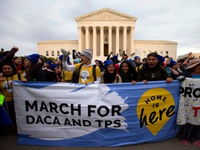 In this file photo taken on Nov. 10, 2019, demonstrators arrive in front of the U.S. Supreme Court during the "Home Is Here" March for Deferred Action for Childhood Arrivals (DACA), and Temporary Protected Status (TPS in Washington D.C.