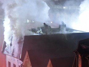 One Toronto firefighter suffered a broken leg and another was critically injured when they plummeted from the roof of a three-storey derelict building on Shuter St. while battling a four-alarm blaze on Saturday Nov. 2, 2019. (Photos supplied by James Doiron)