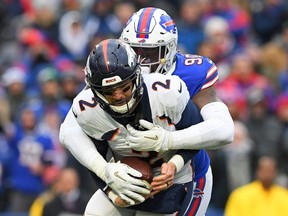Buffalo Bills defensive end Shaq Lawson sacks Denver Broncos quarterback Brandon Allen during the third quarter at New Era Field.