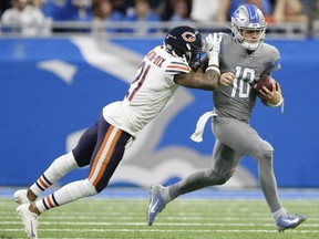 Detroit Lions quarterback David Blough runs the ball against Chicago Bears strong safety Ha Ha Clinton-Dix during the fourth quarter at Ford Field.