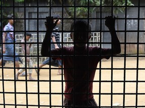 A young Rohingya Muslim refugee waits outside the World Food Programme office in the Bangladeshi town of Ukhia on September 15, 2017. (DOMINIQUE FAGET/AFP/Getty Images)