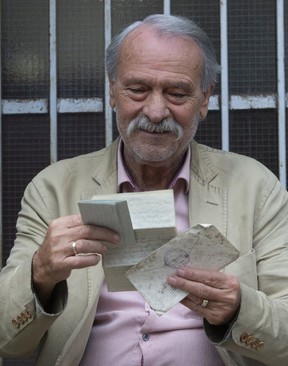 Frank Clemente holds two old letters found in an envelope on a downtown Toronto about 10 years ago. (Stan Behal/Toronto Sun/Postmedia Network)