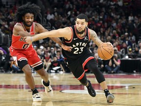 Raptors' Fred VanVleet (right) drives in the second half against Bulls guard Coby White during a recent game in Chicago. (USA TODAY SPORTS)