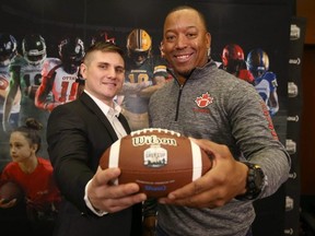 Aaron Geisler, Director of Sport, Football Canada (left) and former CFL star receiver Geeroy Simon   announce a new program for youth to learn the basics of football. JIM WELLS/POSTMEDIA