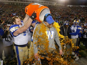 Winnipeg Blue Bombers coach, Mike O'Shea gets the gatorade after beating the  Hamilton Tiger-Cats in the 107th Grey Cup at McMahon stadium in Calgary on Sunday, November 24, 2019. Darren Makowichuk/Postmedia