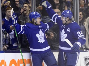 Toronto Maple Leafs centre William Nylander (88) celebrates with goal against Los Angeles Kings goaltender Jonathan Quick with teammate Auston Matthews (34) during third period NHL action in Toronto on Tuesday, Nov. 5, 2019. THE CANADIAN PRESS/Frank Gunn