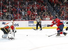 Washington Capitals left wing Alex Ovechkin shoots the puck on Calgary Flames goaltender Cam Talbot in the second period at Capital One Arena.