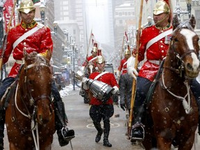 The Grey Cup is paraded down Stephen Ave. in downtown Calgary to kick off the week-long festivities on Tuesday.  
Darren Makowichuk/Postmedia NETWORK