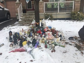 A makeshift memorial outside the Brampton home where two boys were killed. Edwin Bastidas, 52, is facing two counts of first-degree murder in the deaths of his sons Jonathan, 12, and Nicolas, 9.