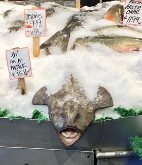 The Pike Place Fish Market will usually have a crowd waiting for a customer to buy a fish that the mongers will then throw before wrapping. (Cynthia McLeod)
