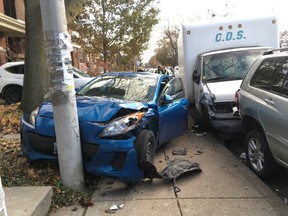 A man was charged with impaired driving after a white cube van struck 15 parked vehicles on Perth Ave. -- just south of Dupont St. -- in Toronto on Friday, Nov. 22, 2019. (Kevin Connor/Toronto Sun/Postmedia Network)