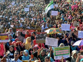 Muslims of 'Tamil Nadu Thowheedh Jamaath' organization hold placards and shout slogans as they protest against the Supreme Court verdict on a disputed religious site of Ayodhya, in Chennai, India, on Monday, Nov. 18, 2019.
