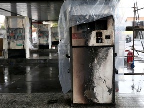 Destroyed petrol pumps are pictured at a gas station, after protests against increased fuel prices, in Tehran, Iran November 20, 2019.