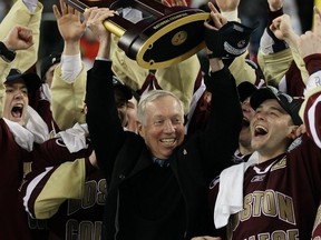 Legendary Boston College coach Jerry York celebrates  
with the Eagles after winning the championship game of the 2010 NCAA Frozen Four in Detroit. York will be inducted into the Hockey Hall of Fame on Monday.  GETTY IMAGES FILE