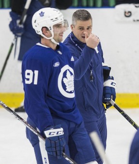 New Maple Leafs coach Sheldon Keefe (right) talks with an upbeat John Tavares during practice at the Ford Performance Centre on Monday. It was Keefe’s first practice as Leafs coach. CRAIG ROBERTSON/TORONTO SUN