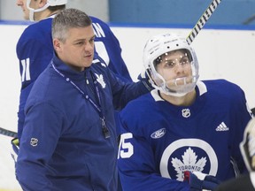 Maple Leafs head coach Sheldon Keefe (left) and forward Alexander Kerfoot at practice on Monday at the Ford Performance Centre. Kerfoot has received a two-game ban from the NHL. (Craig Robertson/Toronto Sun)