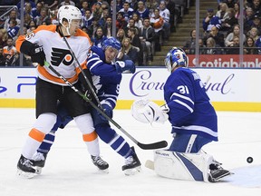 Philadelphia Flyers left wing James van Riemsdyk (25) battles for a puck with Toronto Maple Leafs defenceman Tyson Barrie (94) during the first period at Scotiabank Arena. (Nick Turchiaro-USA TODAY Sports)