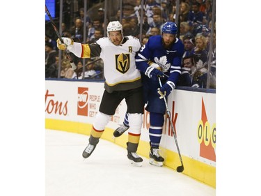 Vegas Golden Knights Jonathan Marchessault C (81) checks Toronto Maple Leafs Jake Muzzin D (8) during the second period in Toronto on Thursday November 7, 2019. Jack Boland/Toronto Sun/Postmedia Network
