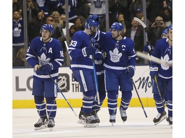 Toronto Maple Leafs John Tavares C (91) celebrates his overtime goal with teammate Frederik Gauthier C (33)  in Toronto on Thursday November 7, 2019. Jack Boland/Toronto Sun/Postmedia Network