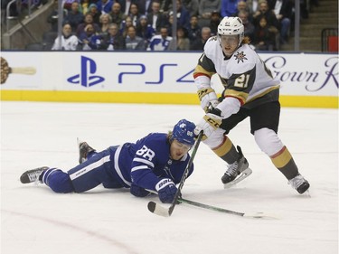 Toronto Maple Leafs William Nylander RW (88) tries to keep the puck fromLas Vegas Knights Cody Eakins (21) during the first period in Toronto on Thursday November 7, 2019. Jack Boland/Toronto Sun/Postmedia Network