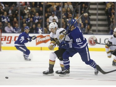 Vegas Golden Knights Shea Theodore D (27) fights with Toronto Maple Leafs Ilya Mikheyev RW (65) for the puck during the first period in Toronto on Thursday November 7, 2019. Jack Boland/Toronto Sun/Postmedia Network